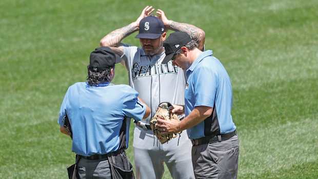 Hector Santiago being checked for sticky substances.